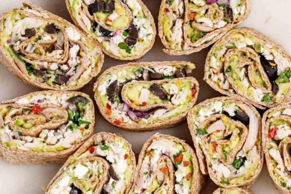 Chicken salad pinwheels on a plate.