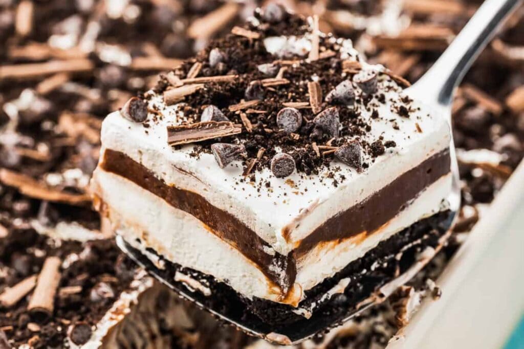 Close-up of chocolate lasagna on a serving spoon.