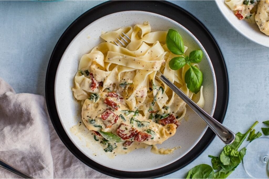 Creamy Tuscan chicken served on a plate.