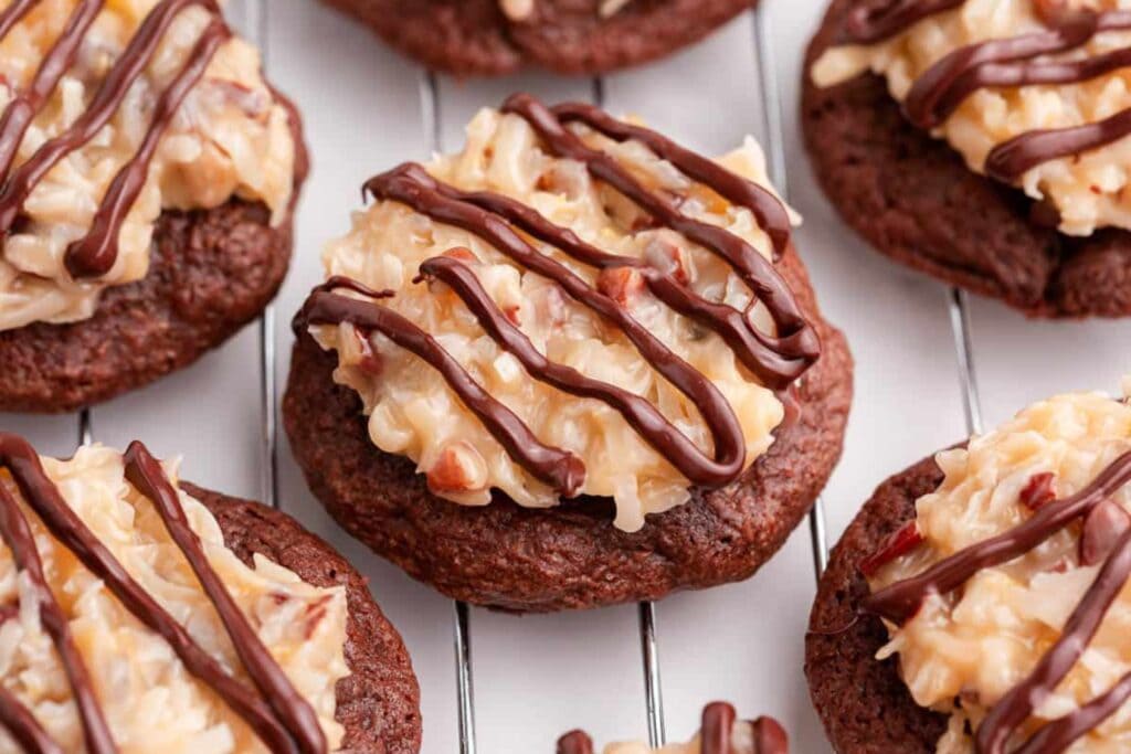 German chocolate cookies on a cooling rack.