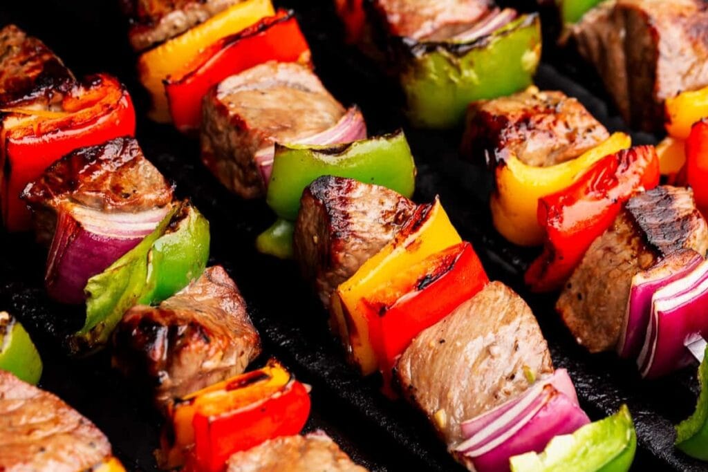 Grilled steak kabobs with bell peppers and red onion.