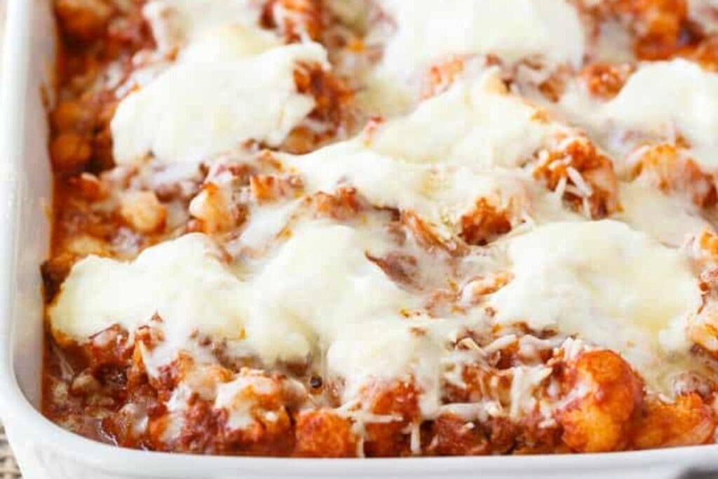 Keto cauliflower ziti in a glass baking dish.