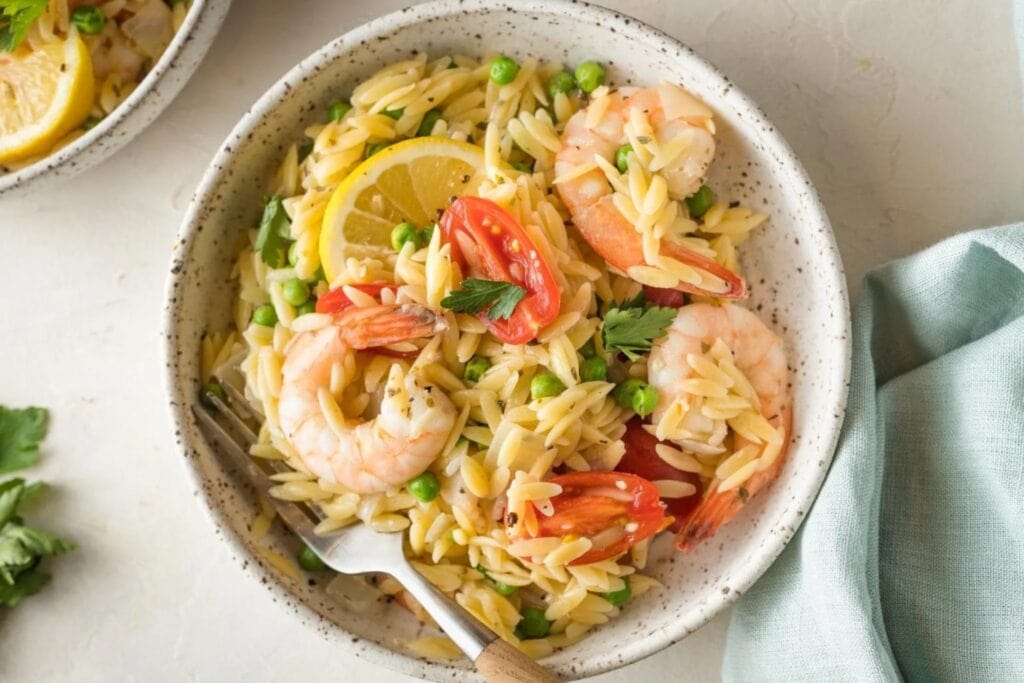 Lemon shrimp orzo in a bowl.