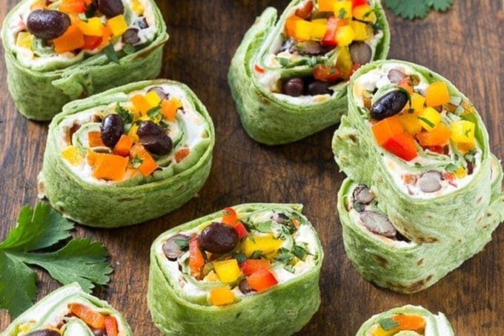 Mexican Tortilla pinwheels on a wooden board.