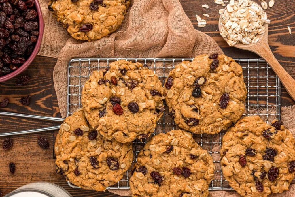 Oatmeal raisin cookies cooling on a wire rack.