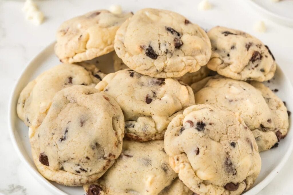 Oreo-stuffed chocolate chip cookies on a plate.