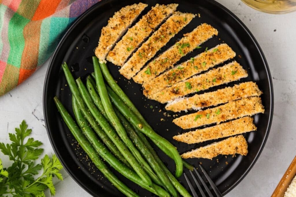 Parmesan crusted chicken on a plate.