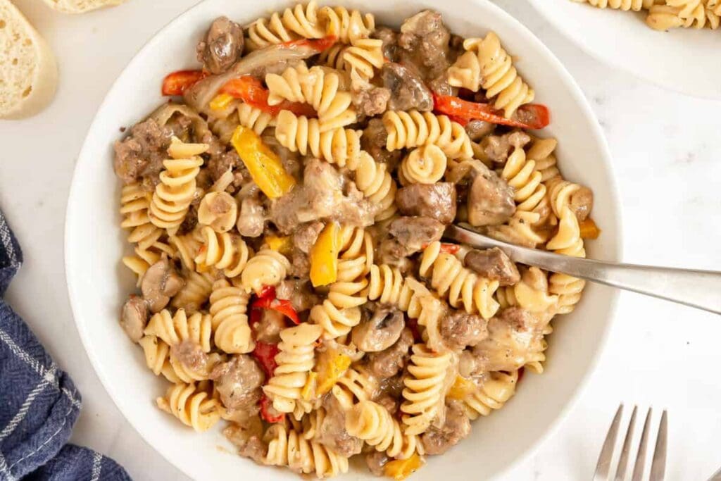 Philly cheesesteak pasta in a bowl.