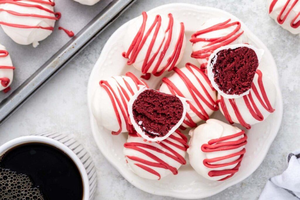 Red velvet cheesecake bites on a plate.