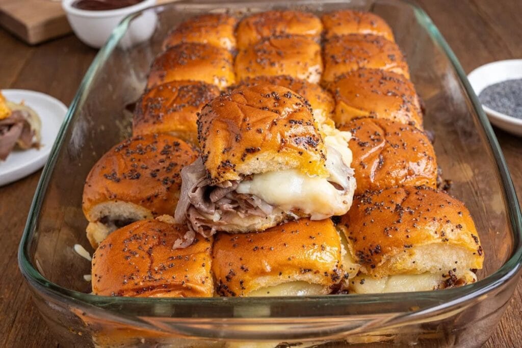 Roast beef sliders in a baking dish.