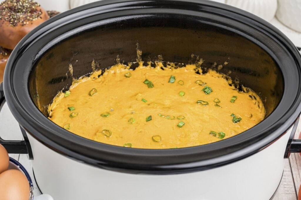 Sausage and green chile breakfast casserole cooked in a slow cooker.