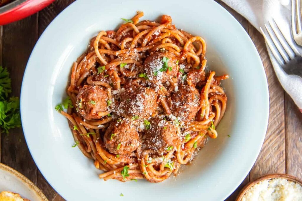 Spaghetti and meatballs on a plate.