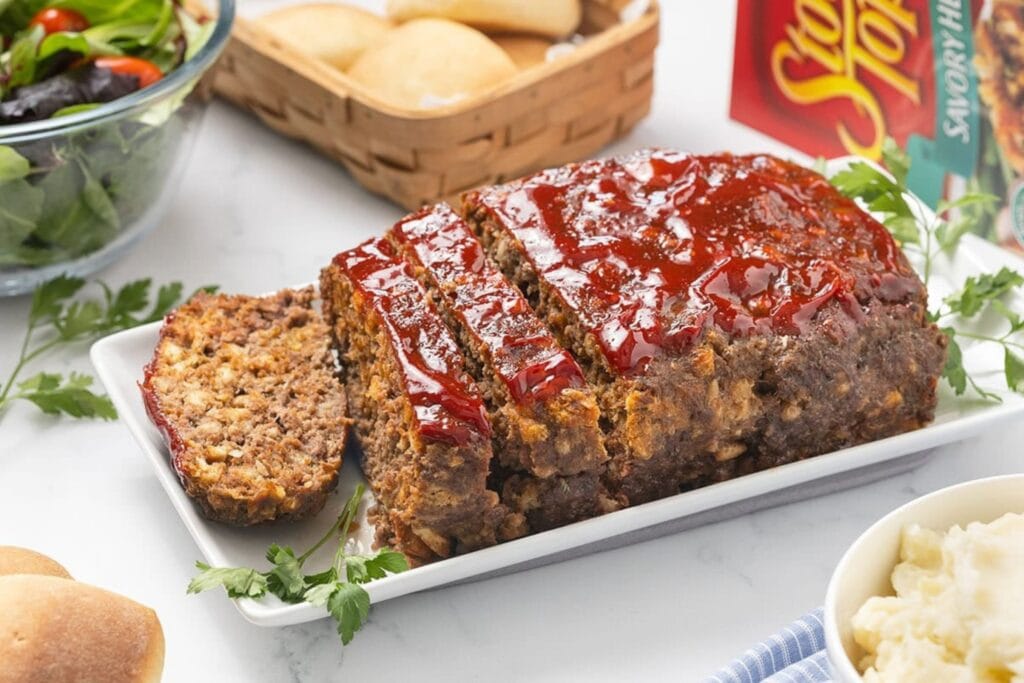 Stove top stuffing meatloaf on a rectangular plate.