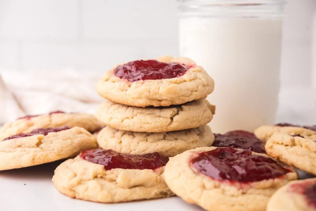 Strawberry thumbprint cookies on a plate.