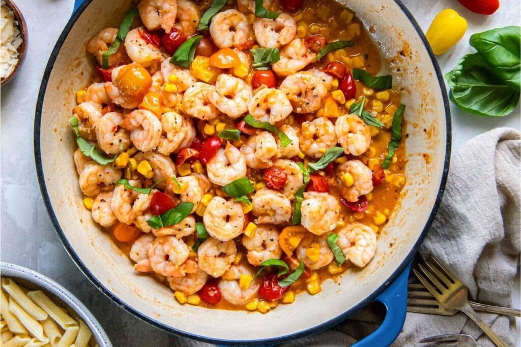 Summer shrimp scampi in a skillet.