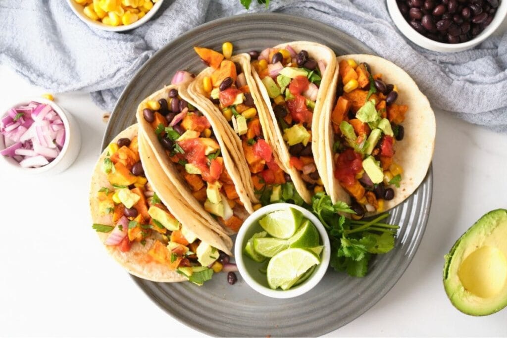 Sweet potato and black bean tacos on a plate.