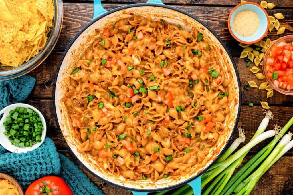 Taco mac and cheese in a skillet.
