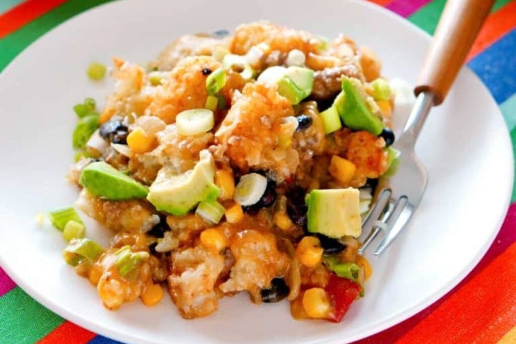 Tater tot casserole on a white plate.