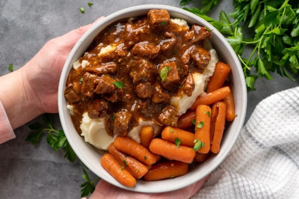 A close up shot of beef tips and gravy.