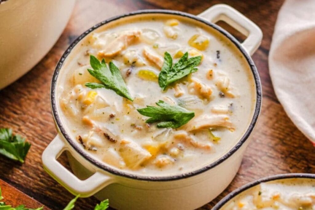 A close up shot of chicken and wild rice soup.
