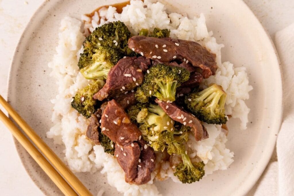 A close up shot of beef and broccoli.