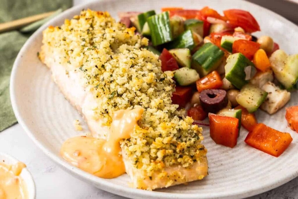 A close up shot of herb and panko crusted salmon.