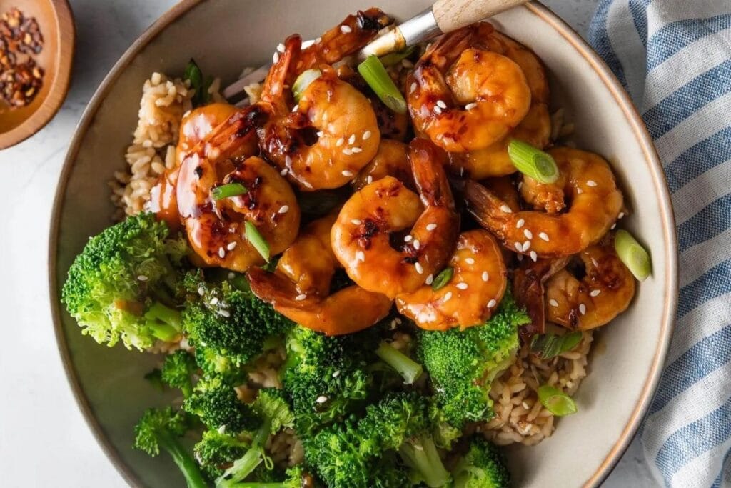A close up shot of honey garlic shrimp.