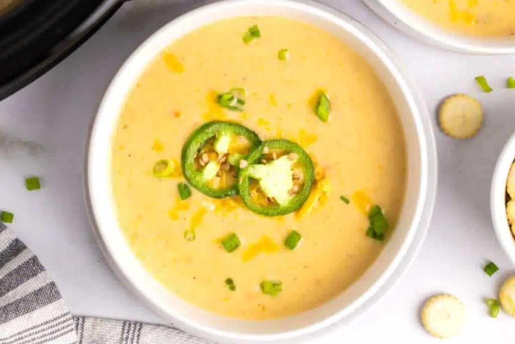 A close up shot of japaleno cheddar potato soup.