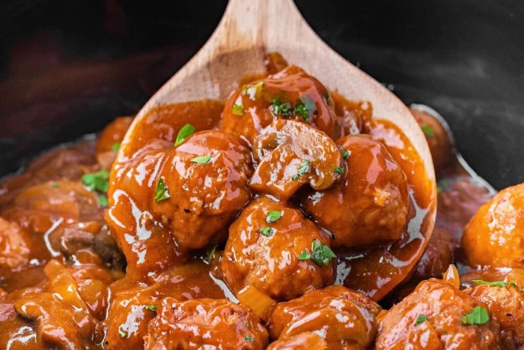 A close up shot of salisbury steak meatballs.