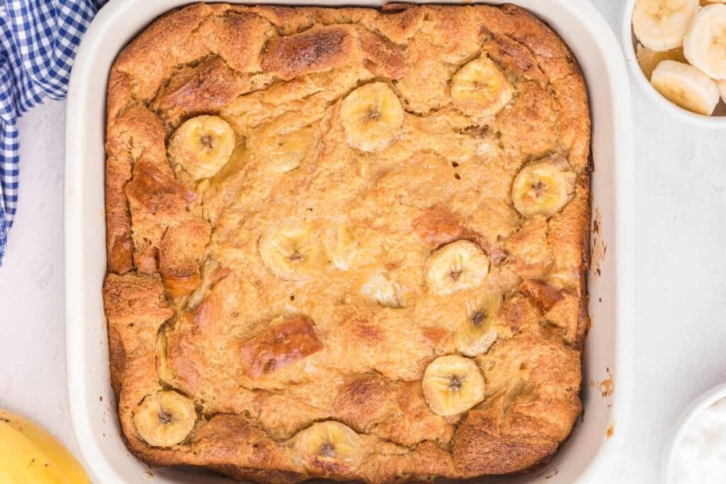 Banana bread breakfast casserole in a square baking dish.
