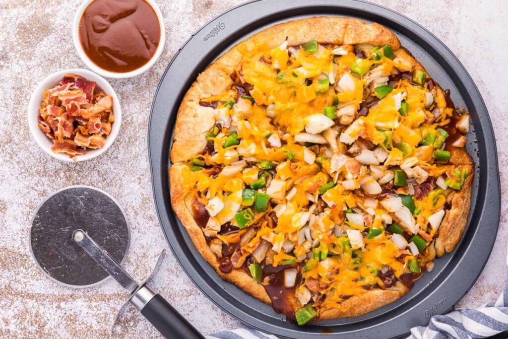 BBQ chicken pizza on a plate.