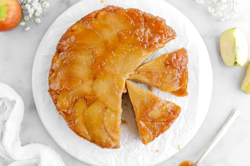 Caramel apple upside down cake on a plate.