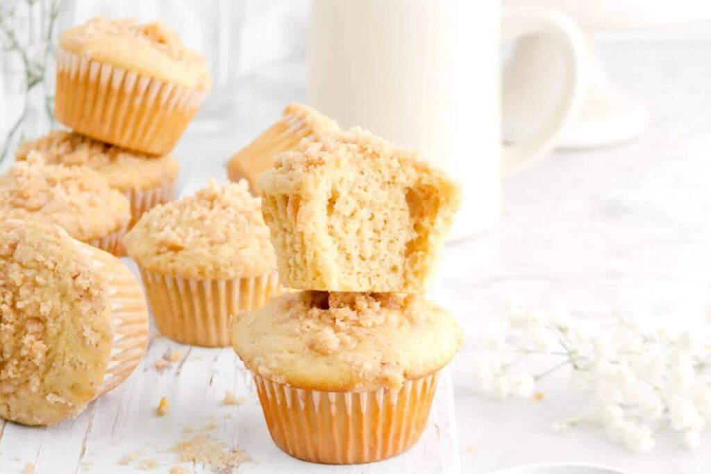 Chai latte muffins with chai spiced streusel on a white table.