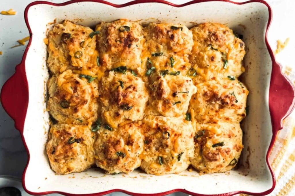 Cheddar Bay breakfast casserole with sausage and eggs in a baking dish.