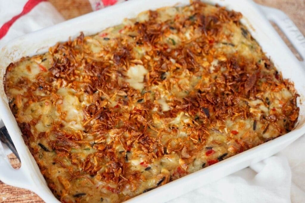 Chicken and wild rice casserole in a baking dish.