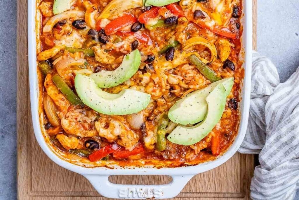 Chicken fajita casserole in a baking dish.