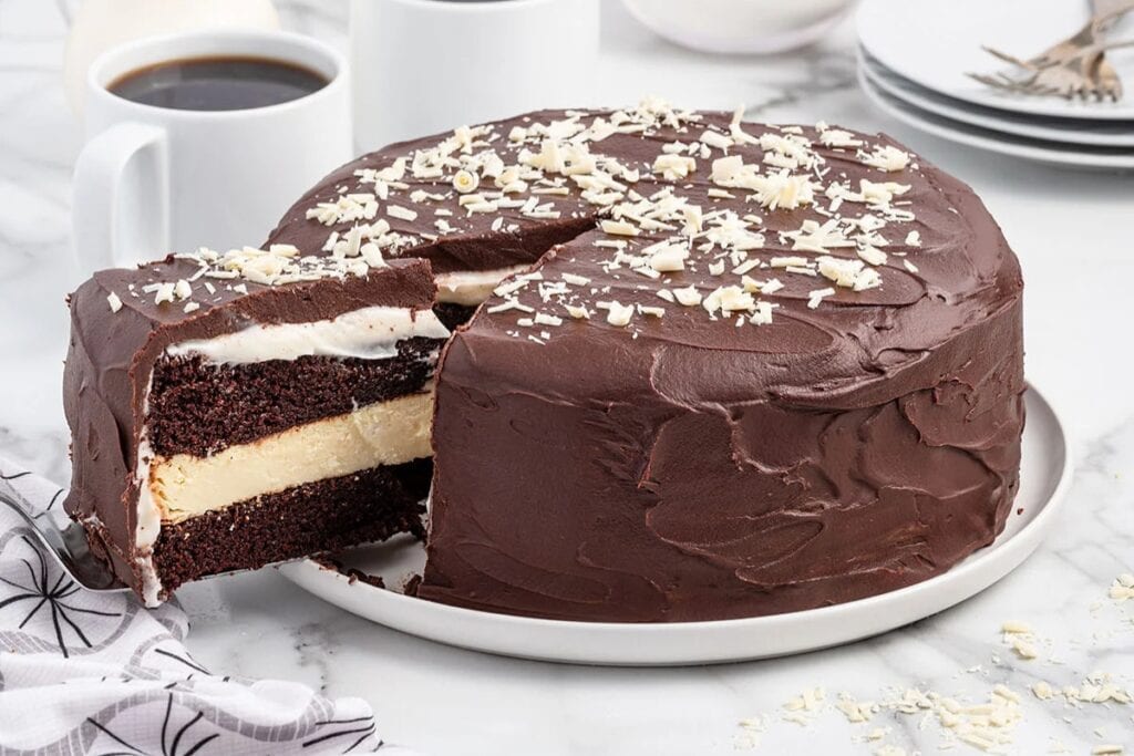 Chocolate layer cheesecake on a plate.