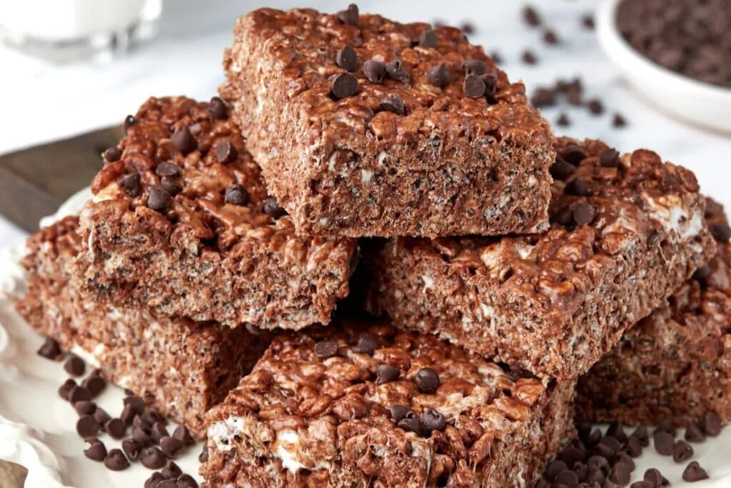 Chocolate rice krispie squares on a plate.