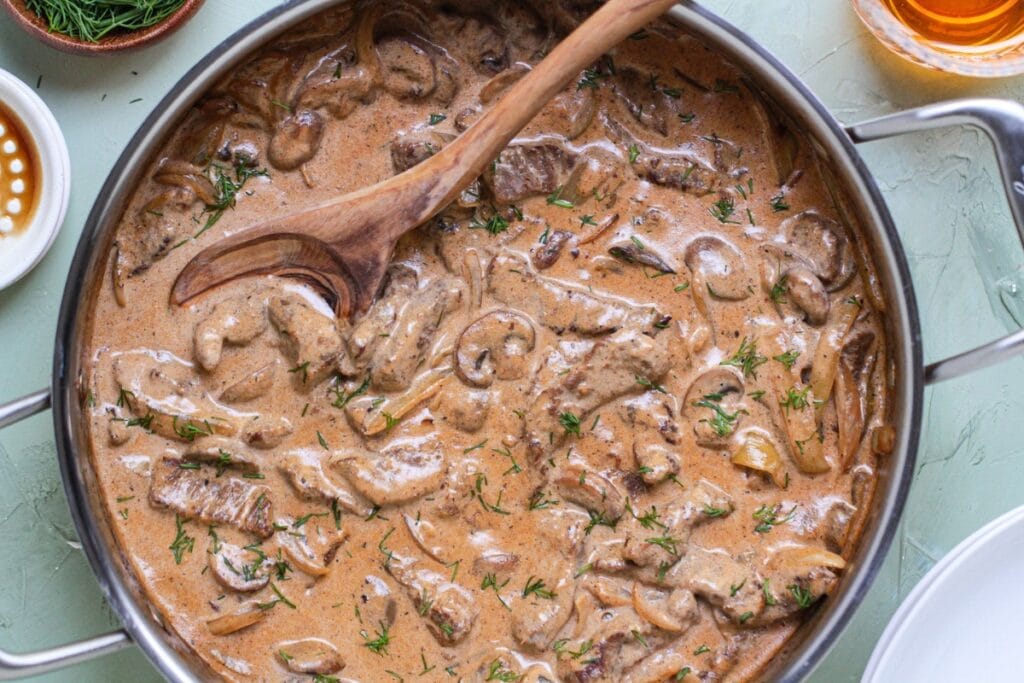Classic beef stroganoff in a skillet.