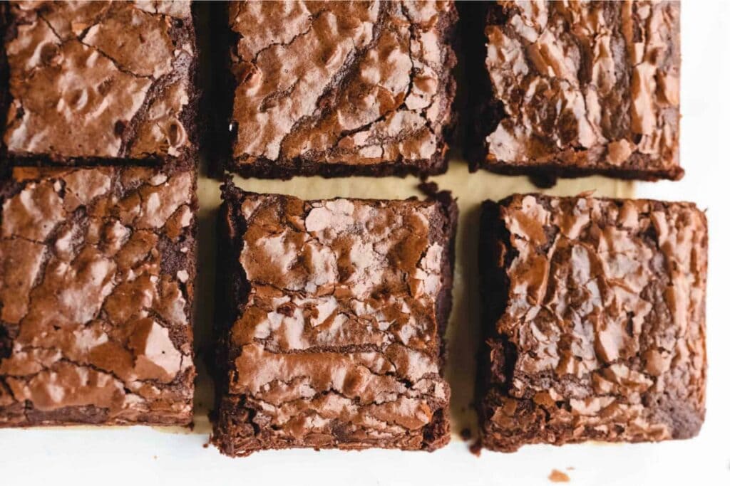 Cocoa powder brownies on parchment paper.