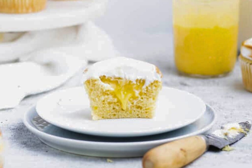 Lemon meringue cupcake on a plate.