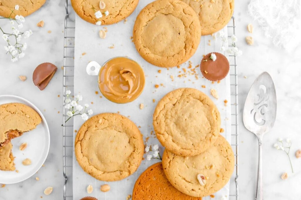 Reese&rsquo;s Stuffed Peanut Butter Cookies on a cooling rack.