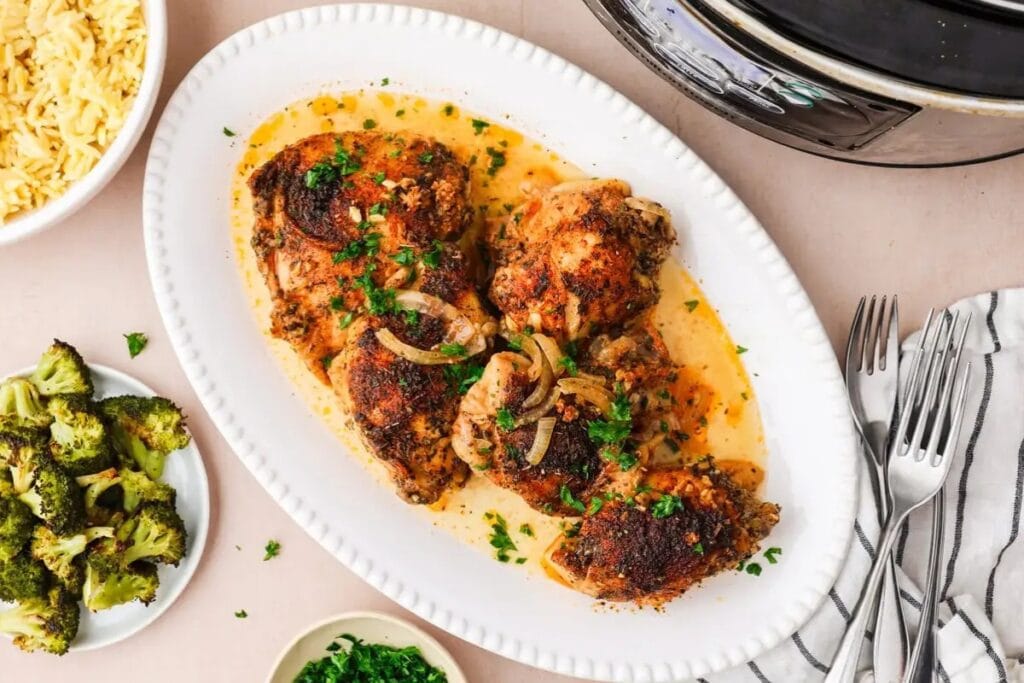 Slow cooker Italian chicken with herbs on a plate.