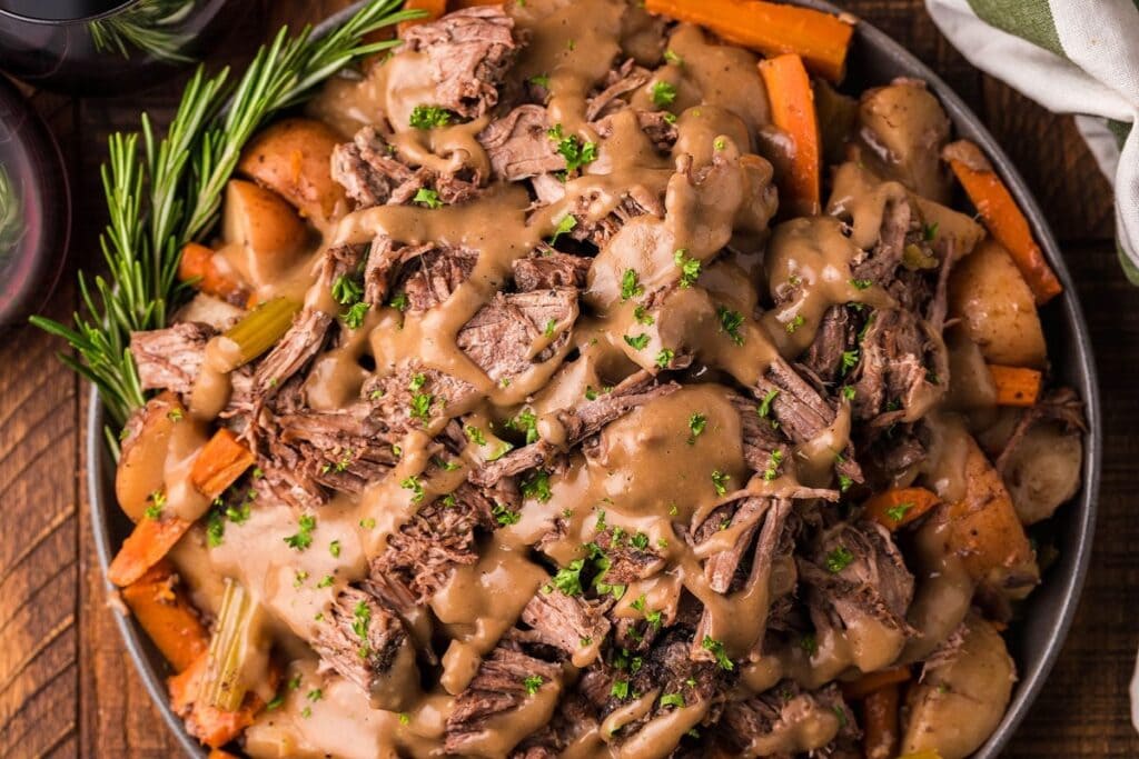 Close up of slow cooker pot roast with red wine.