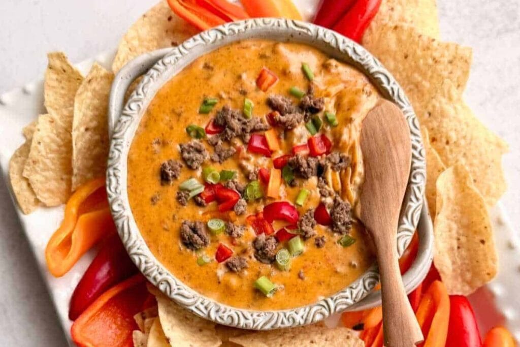 Slow cooker rotel dip in a bowl.
