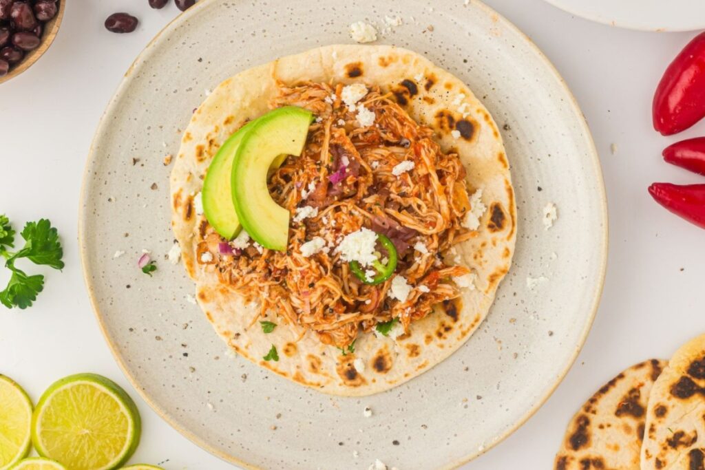Slow cooker salsa chicken on a plate.