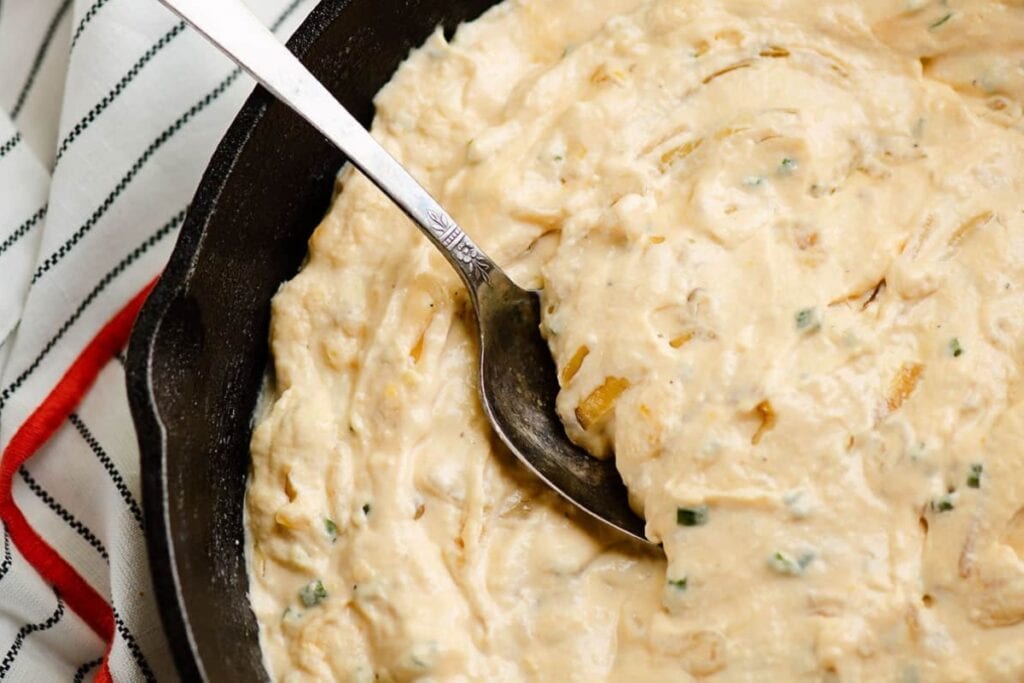 Traeger smoked cheesy caramelized onion dip in a bowl.