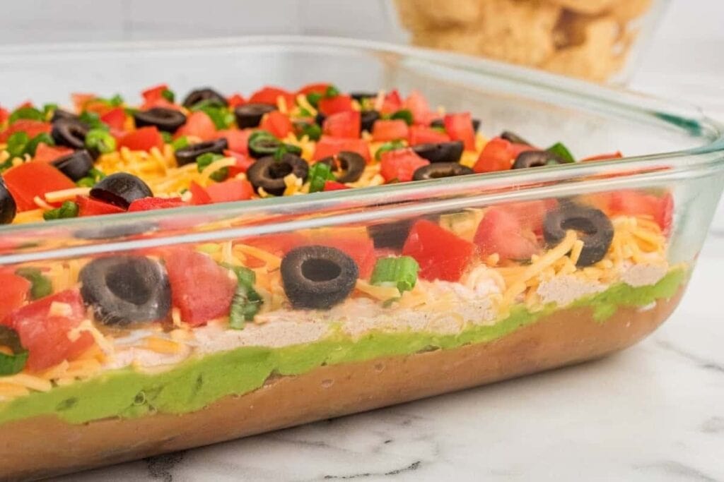 A close up shot of 7 layer taco dip.