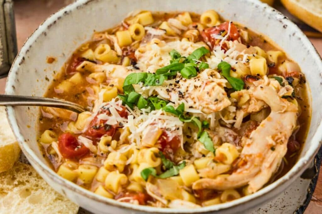 A close up shot of chicken parmesan soup.