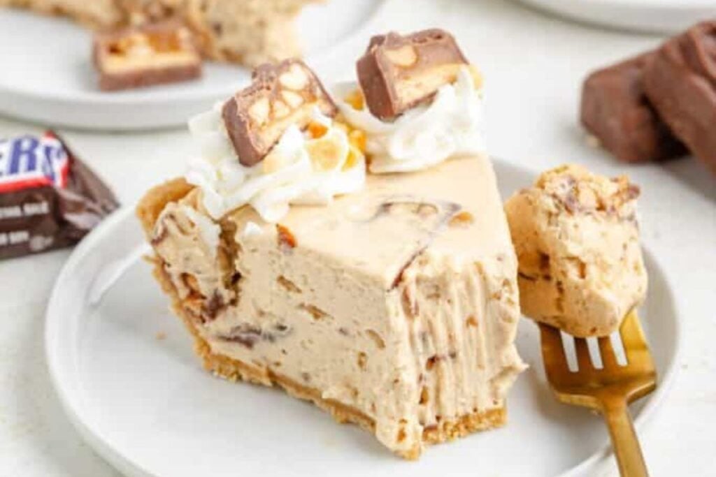 A close up shot of snickers pie.